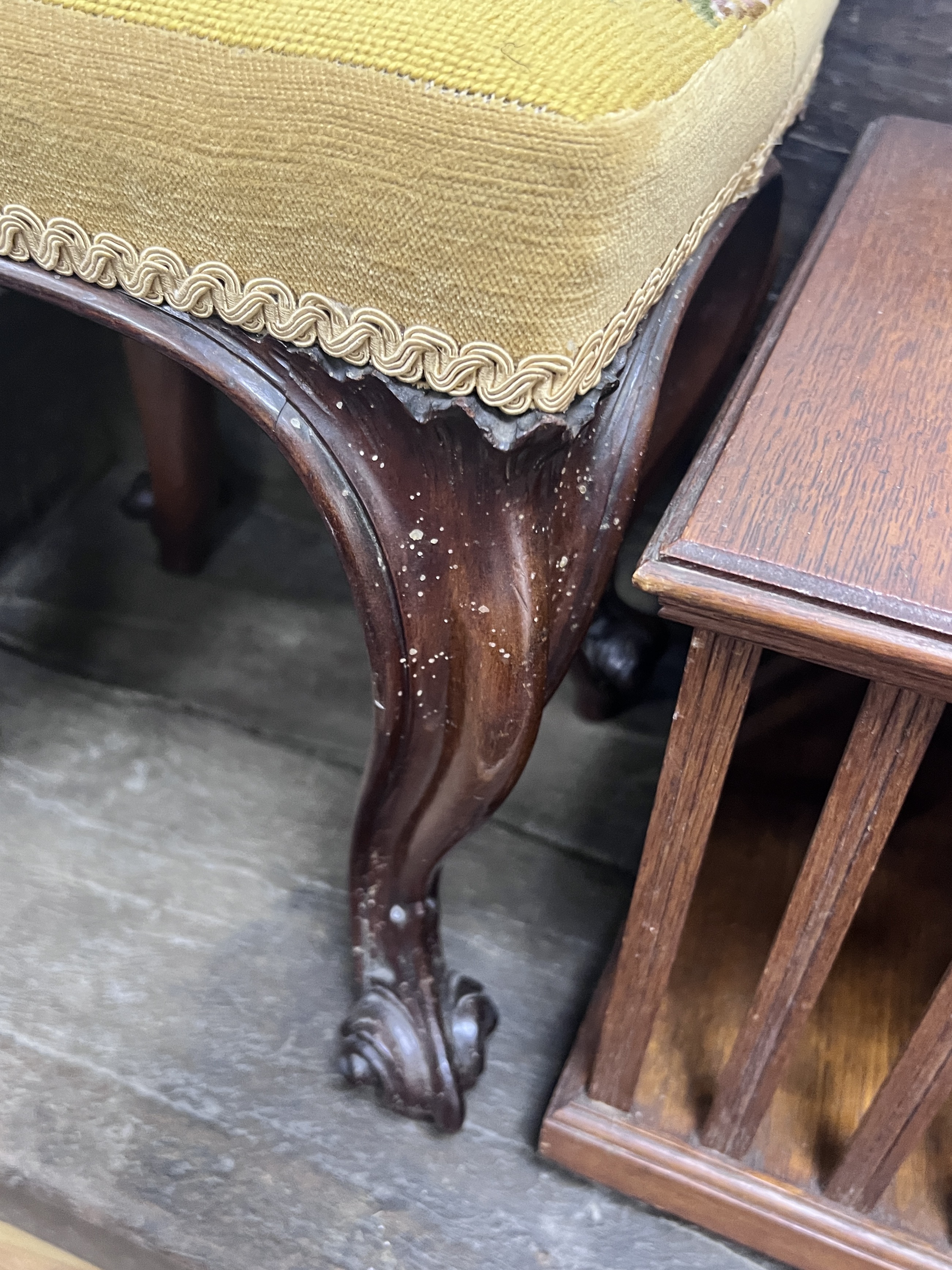 A Victorian carved mahogany footstool, width 32cm, height 40cm